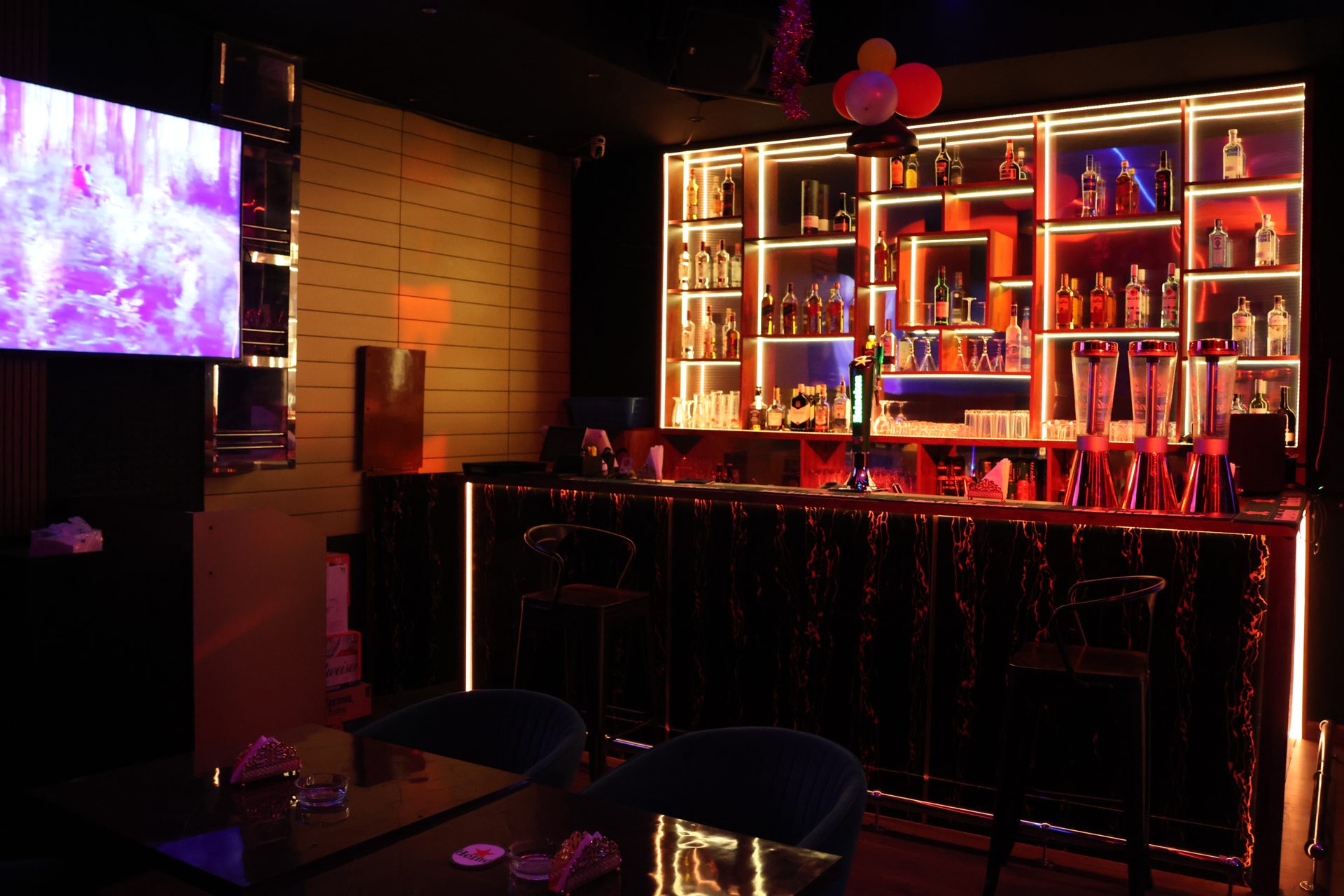 E-TOWN Resto Lounge bar with warm backlit shelves