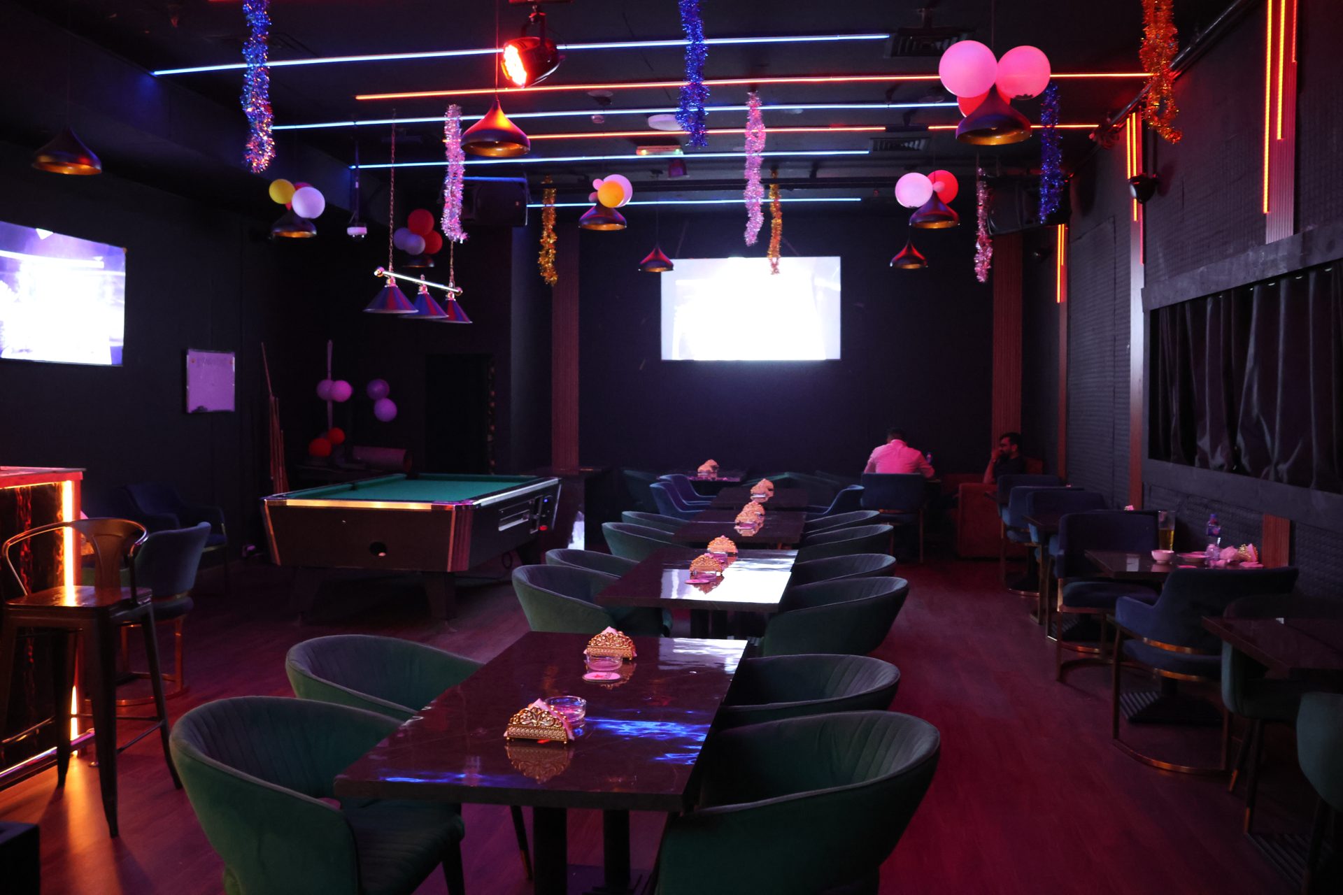 E-TOWN Resto Lounge dining tables and neon ceiling lights